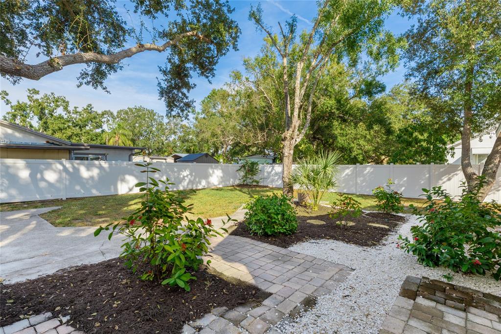 3011 6th Street Sarasota, FL 34237 - Photo 22 of 23 a view of a yard with plants and large trees