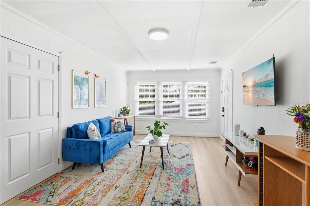 3011 6th Street Sarasota, FL 34237 - Photo 9 of 23 a living room with furniture and a flat screen tv