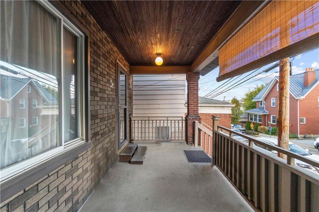 24 High Street Pittsburgh, PA 15223 - Photo 5 of 12 a view of a porch with wooden floor and iron stairs