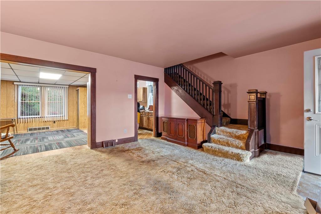 24 High Street Pittsburgh, PA 15223 - Photo 7 of 12 a view of an empty room with stairs and a window