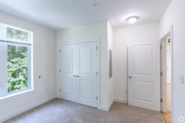 a view of an empty room with a window