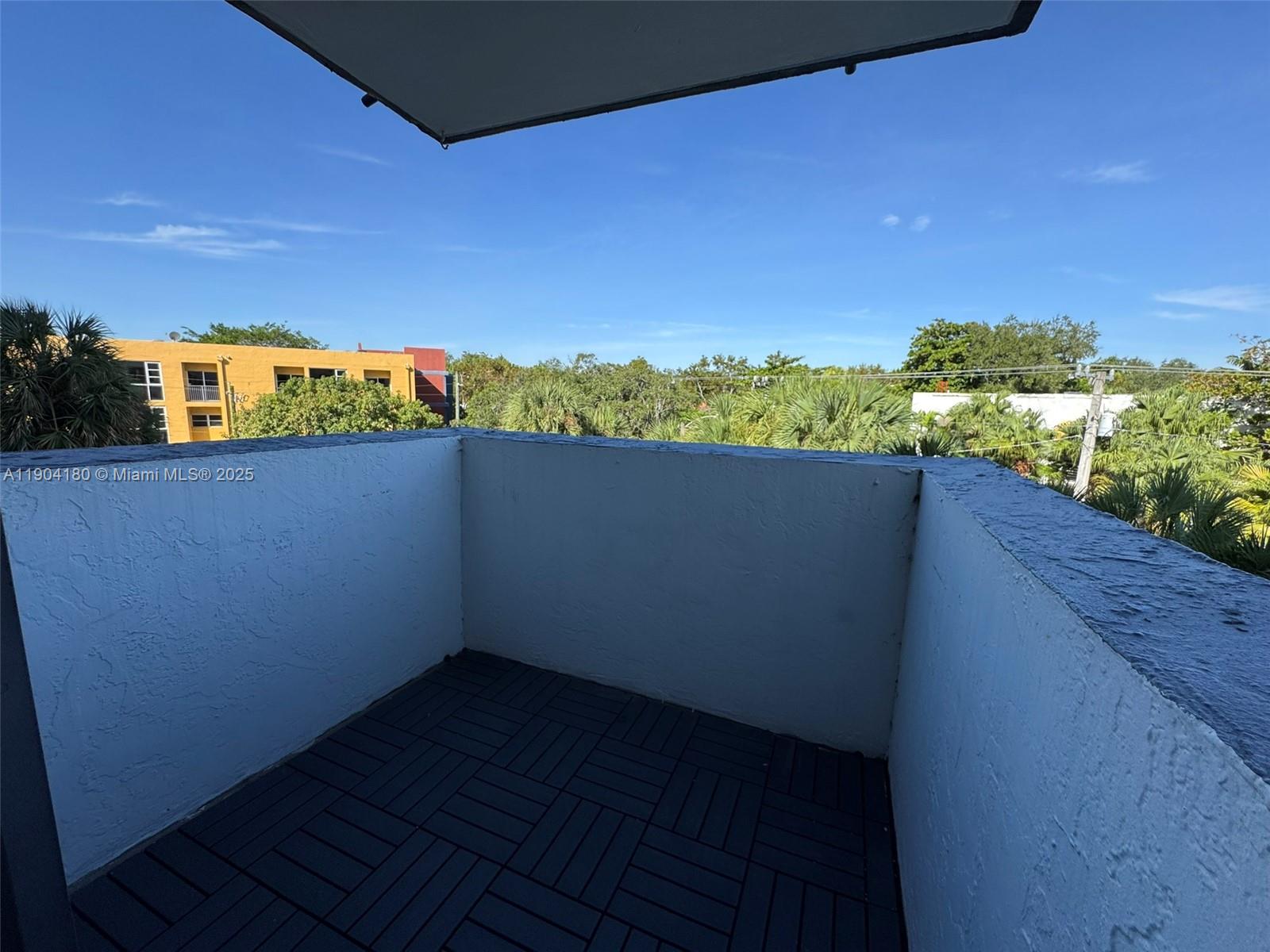 2715 Tigertail Avenue, Unit 404 Miami, FL 33133 - Photo 15 of 22 a view of outdoor space with wooden floor