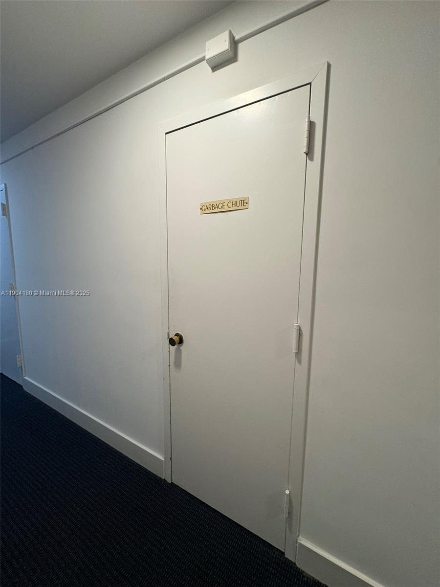 2715 Tigertail Avenue, Unit 404 Miami, FL 33133 - Photo 20 of 22 a bathroom with a glass shower door