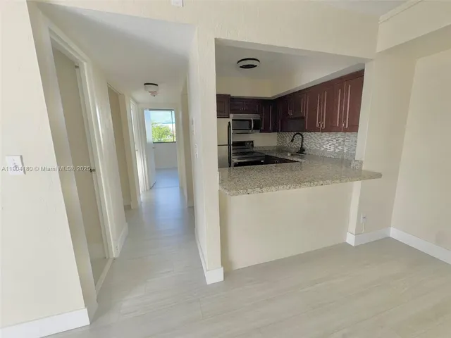 a view of kitchen and sink
