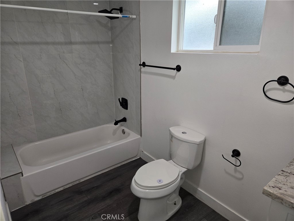 5327 Tyler Street, Unit B Riverside, CA 92503 - Photo 3 of 4 a bathroom with a sink a toilet and a bathtub