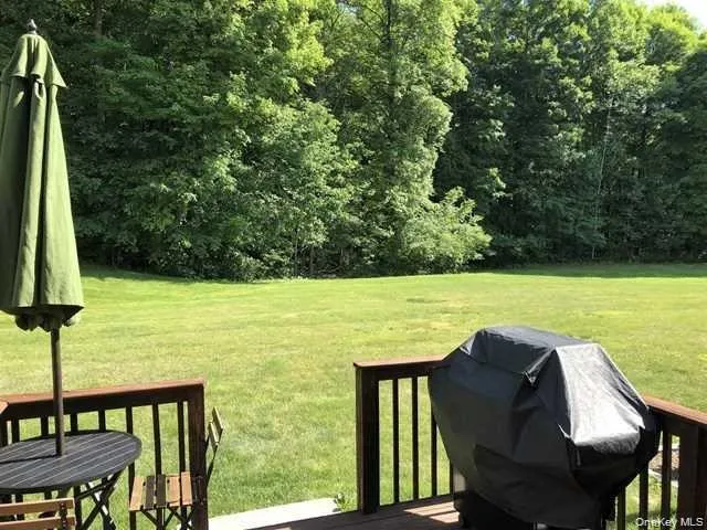 a view of a chairs and table in the pool