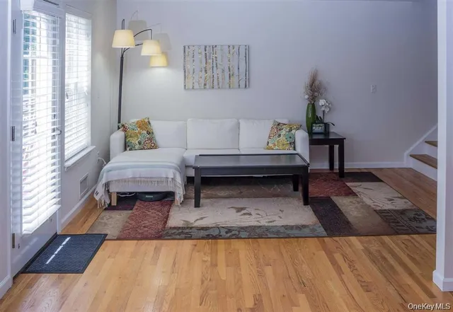 a living room with furniture and a rug