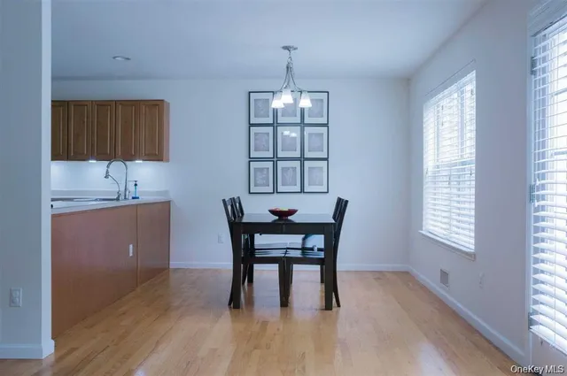 a view of a dining room with furniture and window