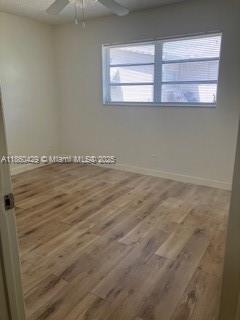 6181 Southwest 41st Court, Unit 1 Davie, FL 33314 - Photo 20 of 26 2nd guest bedroom with wood laminate flooring