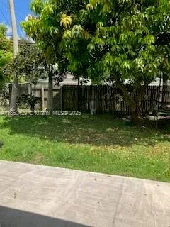 a view of a backyard of the house