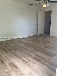 6181 Southwest 41st Court, Unit 1 Davie, FL 33314 - Photo 9 of 26 family room - door into utility room with W/D hot water htr.