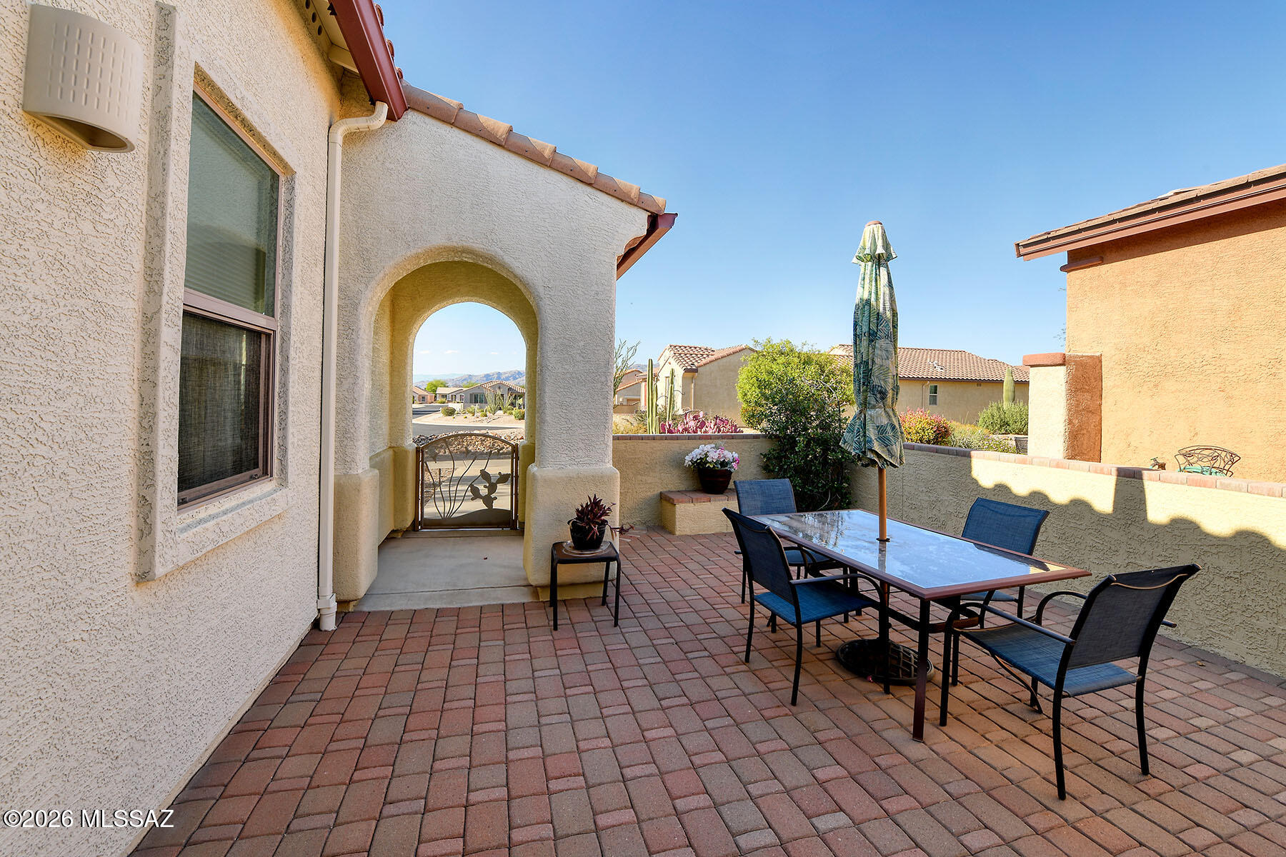 13991 East Cheavront Loop Vail, AZ 85641 - Photo 41 of 47 a view of a patio with a table and chairs
