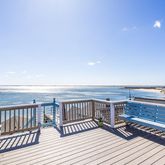 a view of a balcony with wooden floor