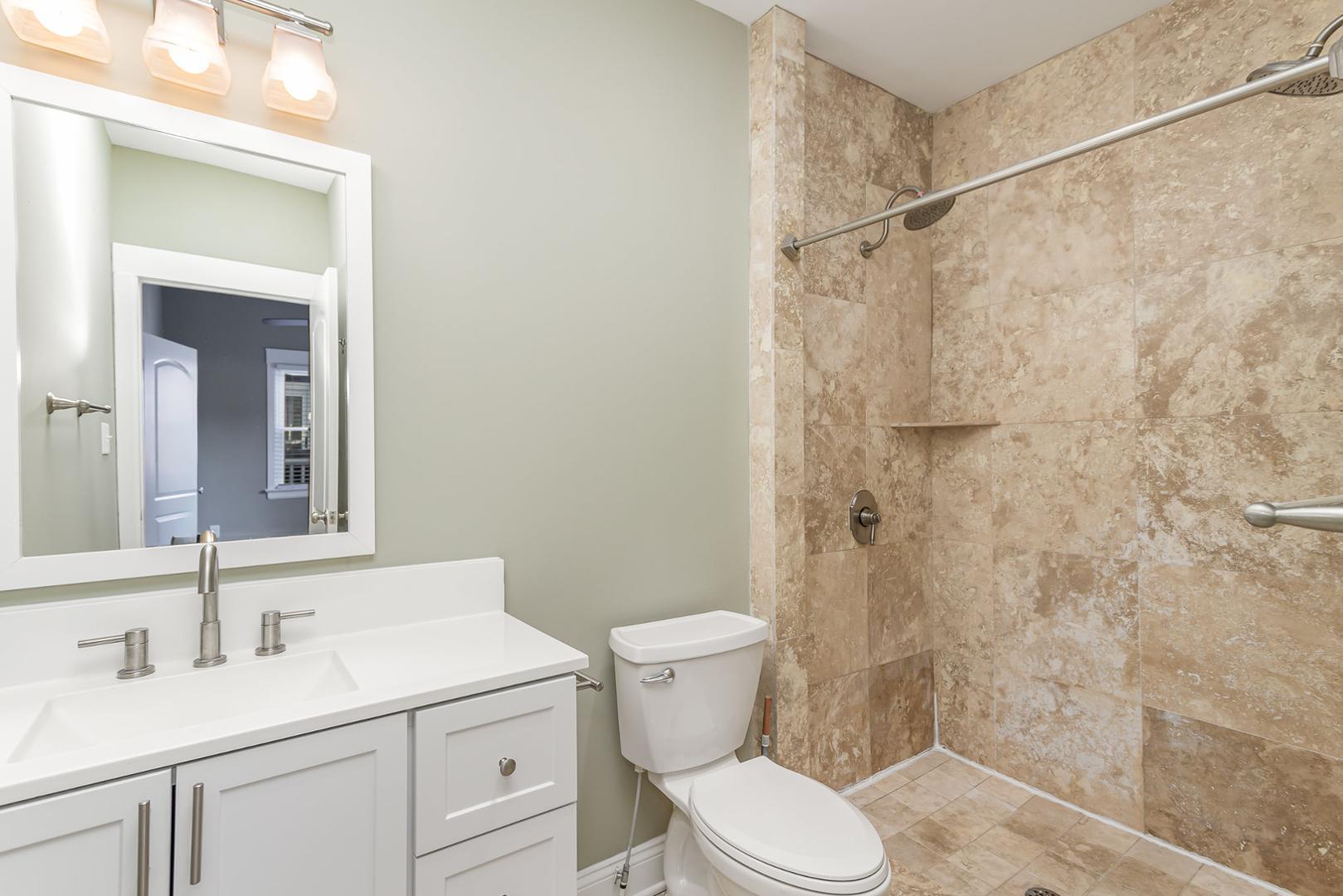 510 South Saunders Street Raleigh, NC 27603 - Photo 17 of 23 a bathroom with a sink toilet and shower