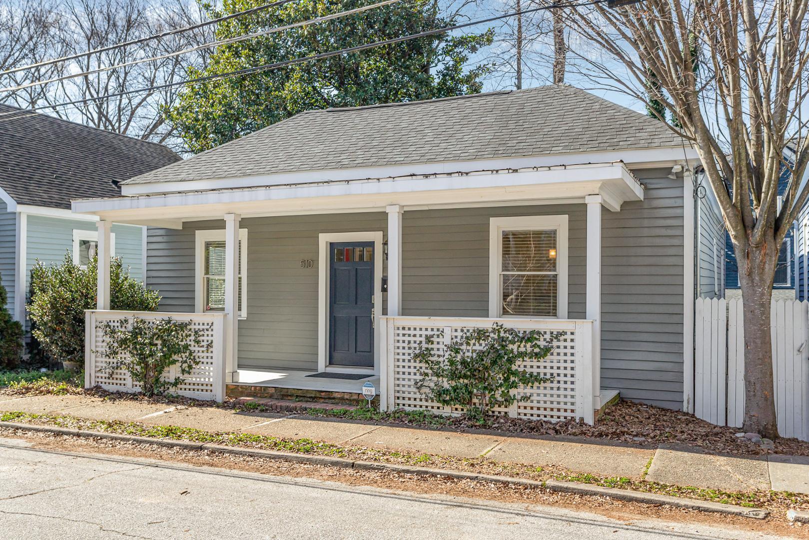 510 South Saunders Street Raleigh, NC 27603 - Photo 2 of 23 a view of a house with a yard and large tree