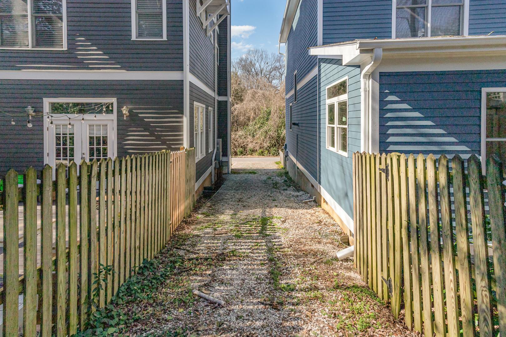 510 South Saunders Street Raleigh, NC 27603 - Photo 23 of 23 a view of a pathway of a house with wooden fence