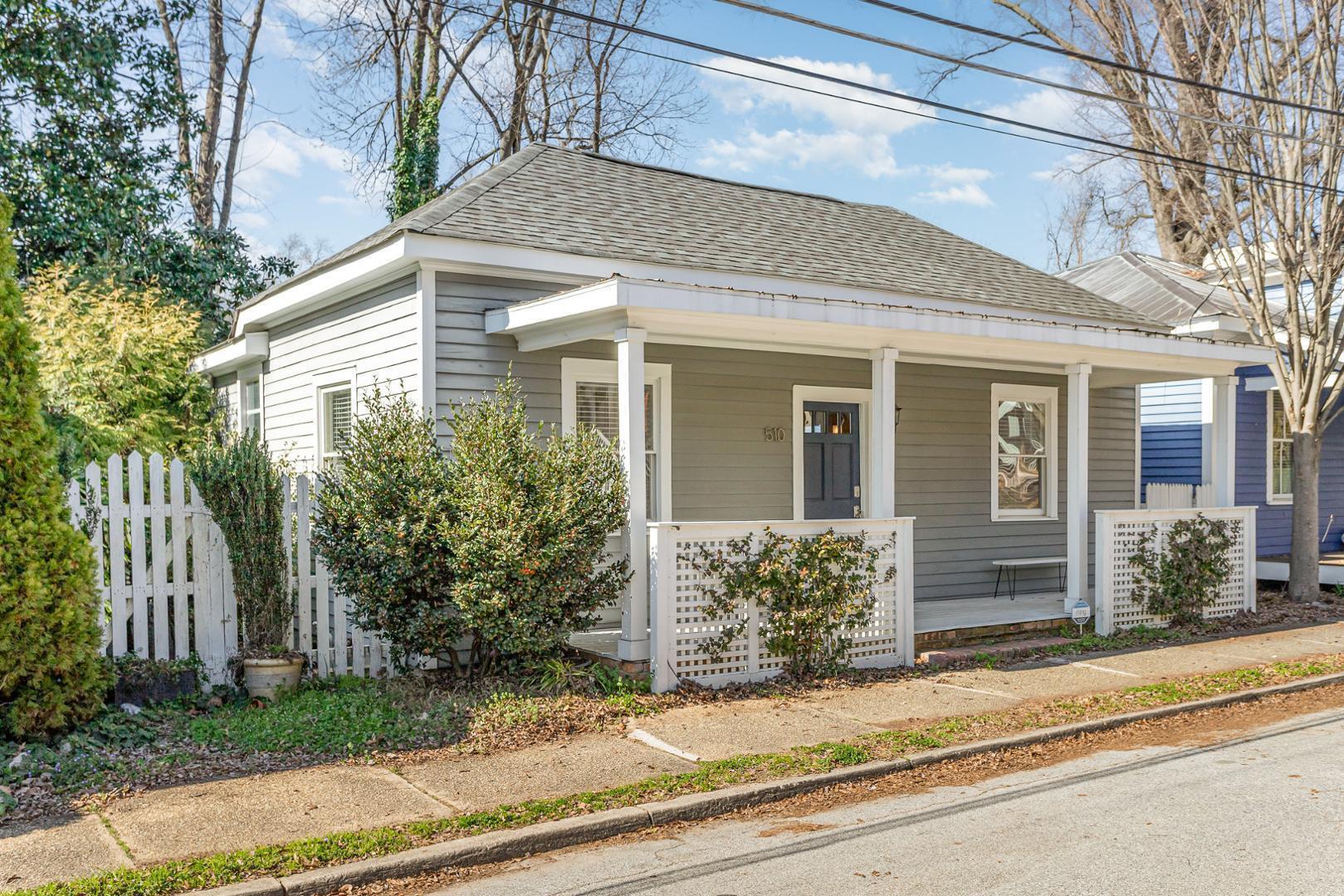 510 South Saunders Street Raleigh, NC 27603 - Photo 3 of 23 a front view of a house with a yard