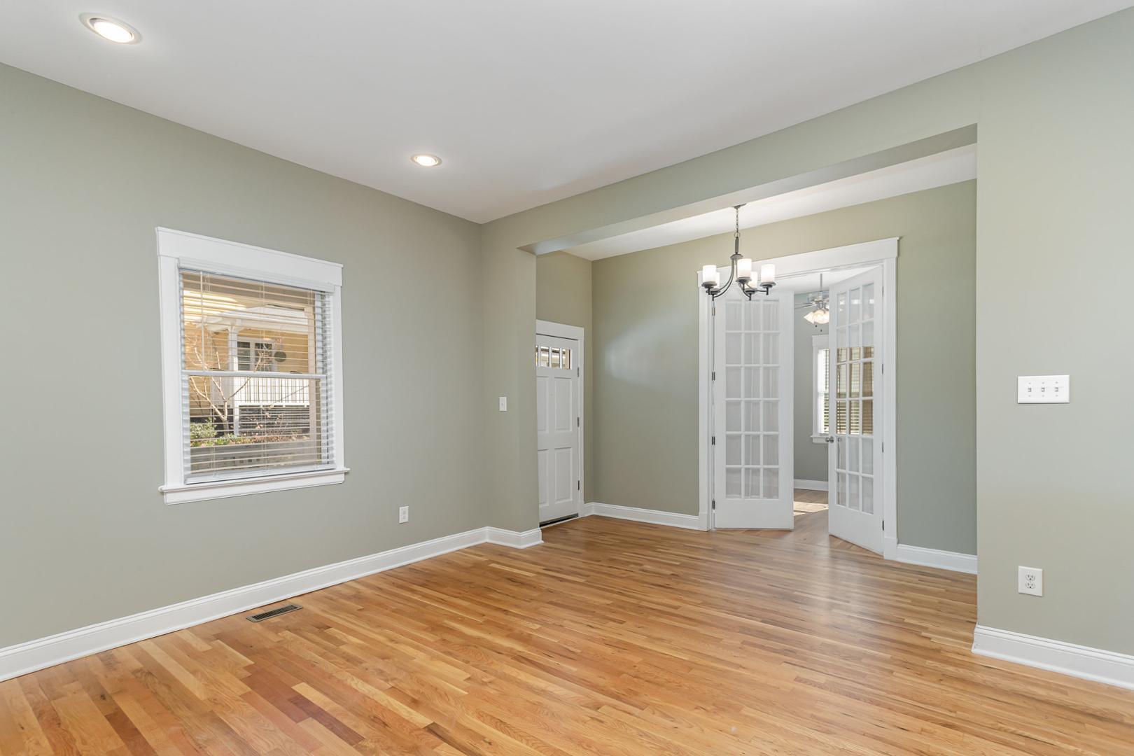 510 South Saunders Street Raleigh, NC 27603 - Photo 4 of 23 a view of a room with wooden floor and windows