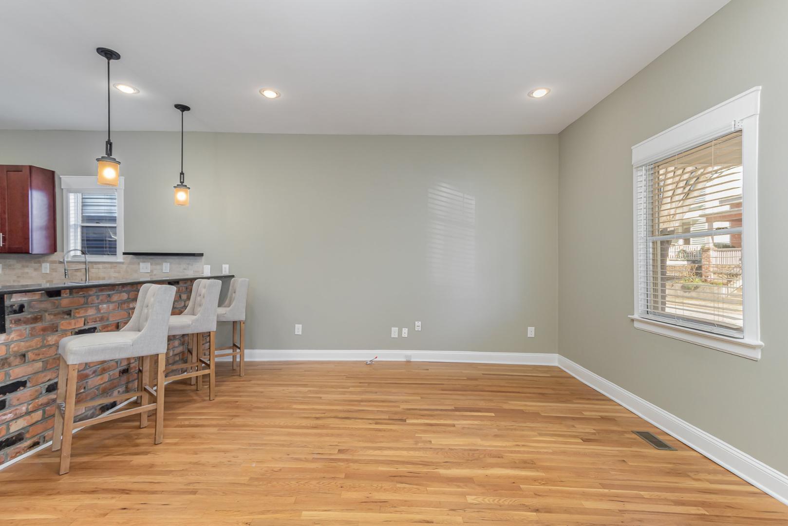 510 South Saunders Street Raleigh, NC 27603 - Photo 7 of 23 a view of a room with wooden floor and staircase