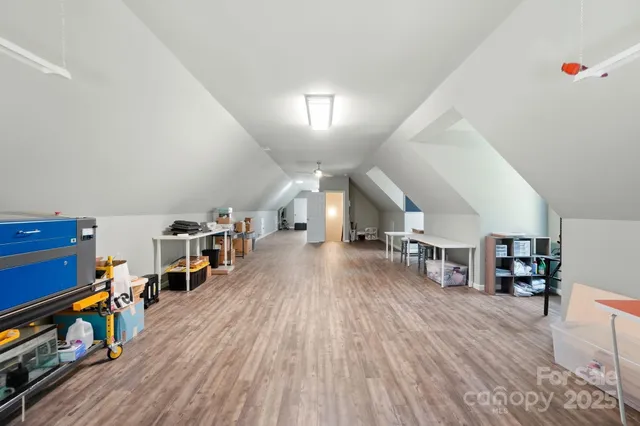 a living room with lots of furniture and a book shelf