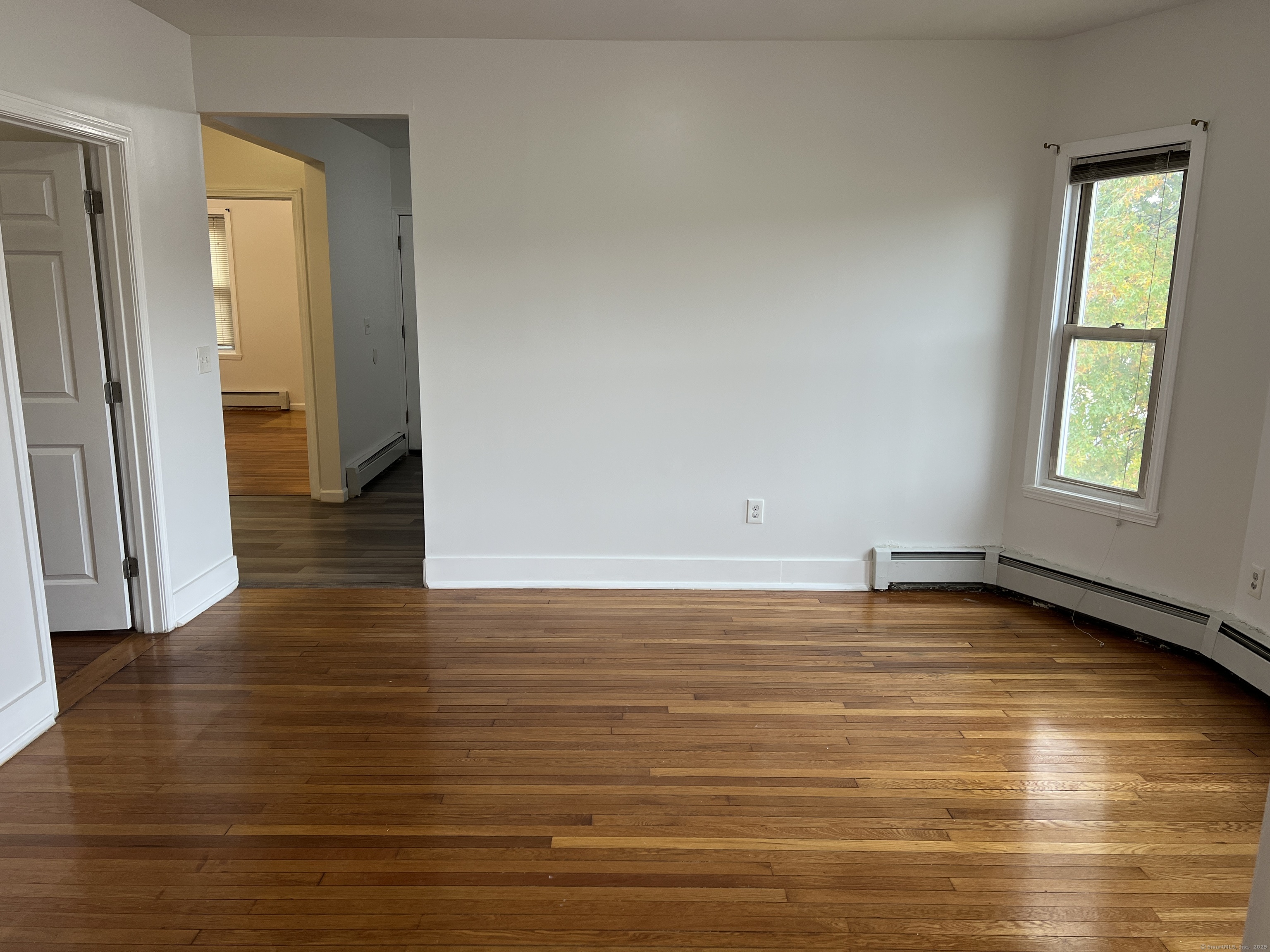 4 Magnolia Street, Unit 2 Hartford, CT 06112 - Photo 5 of 17 a view of a room with wooden floor and a window