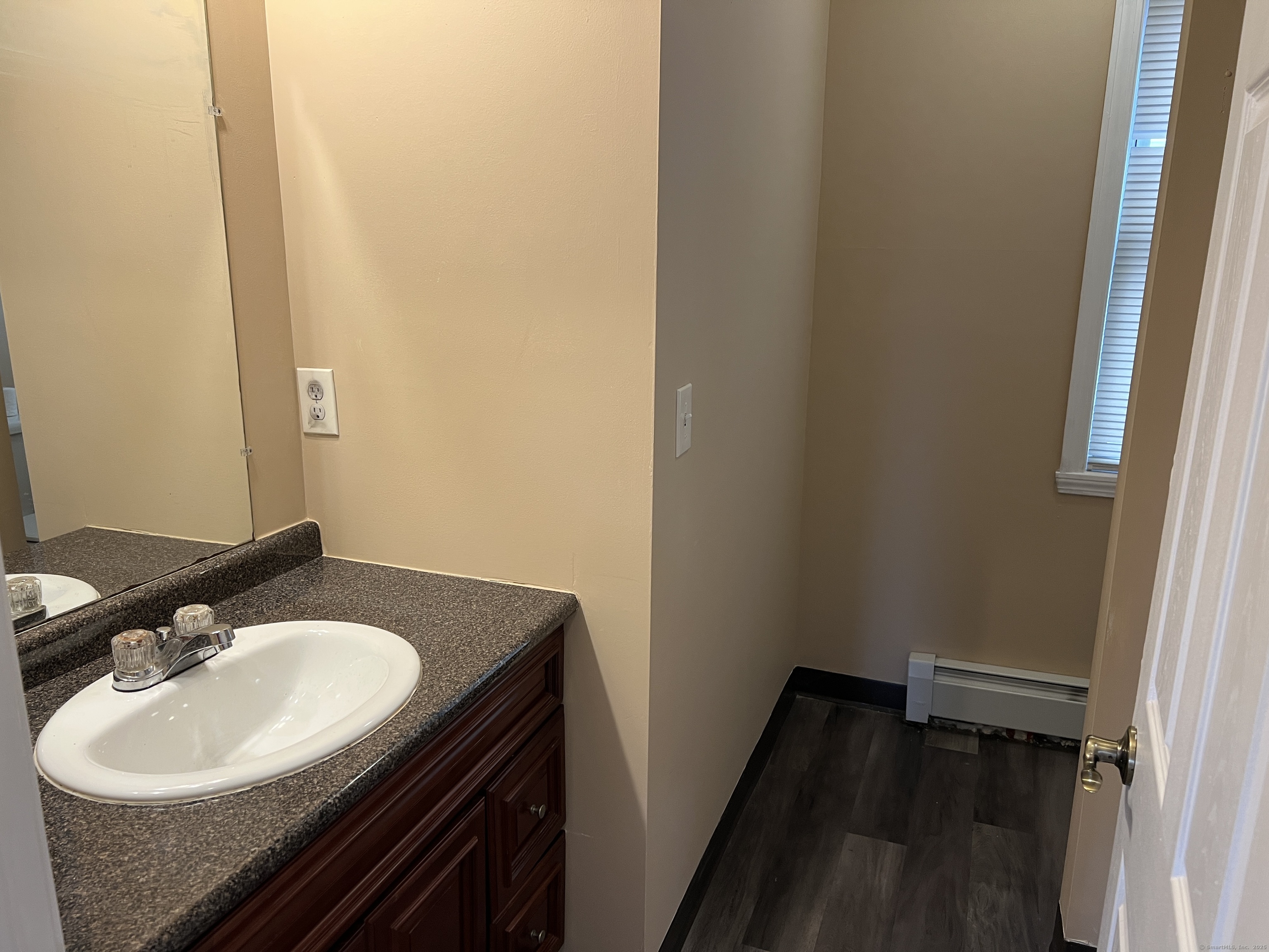 4 Magnolia Street, Unit 2 Hartford, CT 06112 - Photo 7 of 17 a bathroom with a sink and a mirror