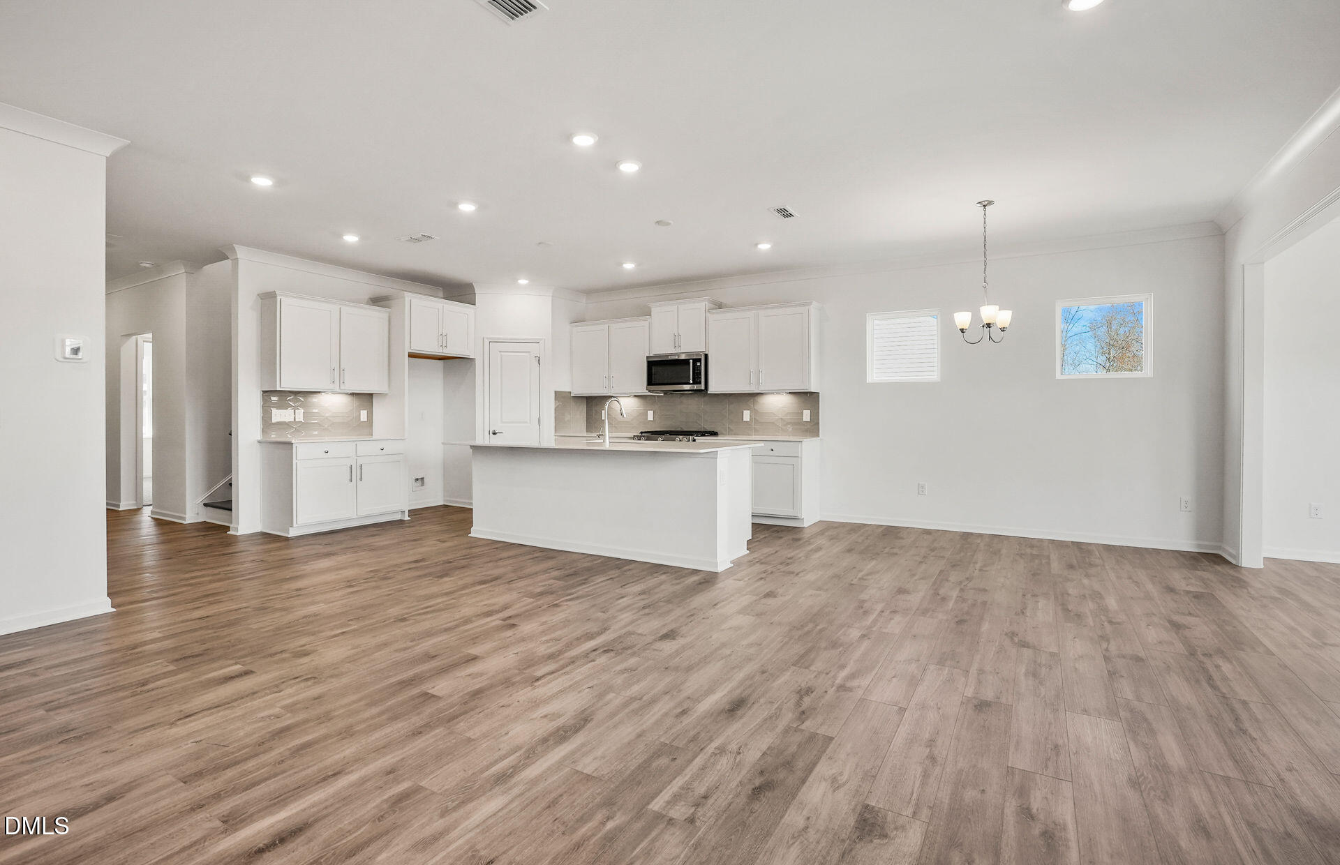 200 Armorial Court Willow Spring, NC 27592 - Photo 11 of 33 a view of kitchen with wooden floor and window