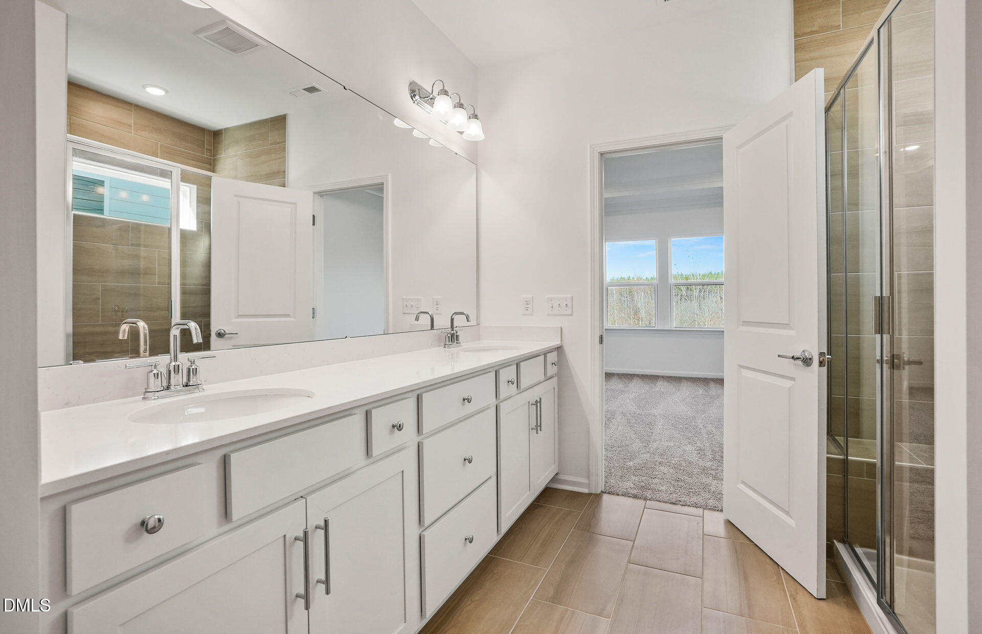 200 Armorial Court Willow Spring, NC 27592 - Photo 20 of 33 a spacious bathroom with a double vanity sink mirror and shower