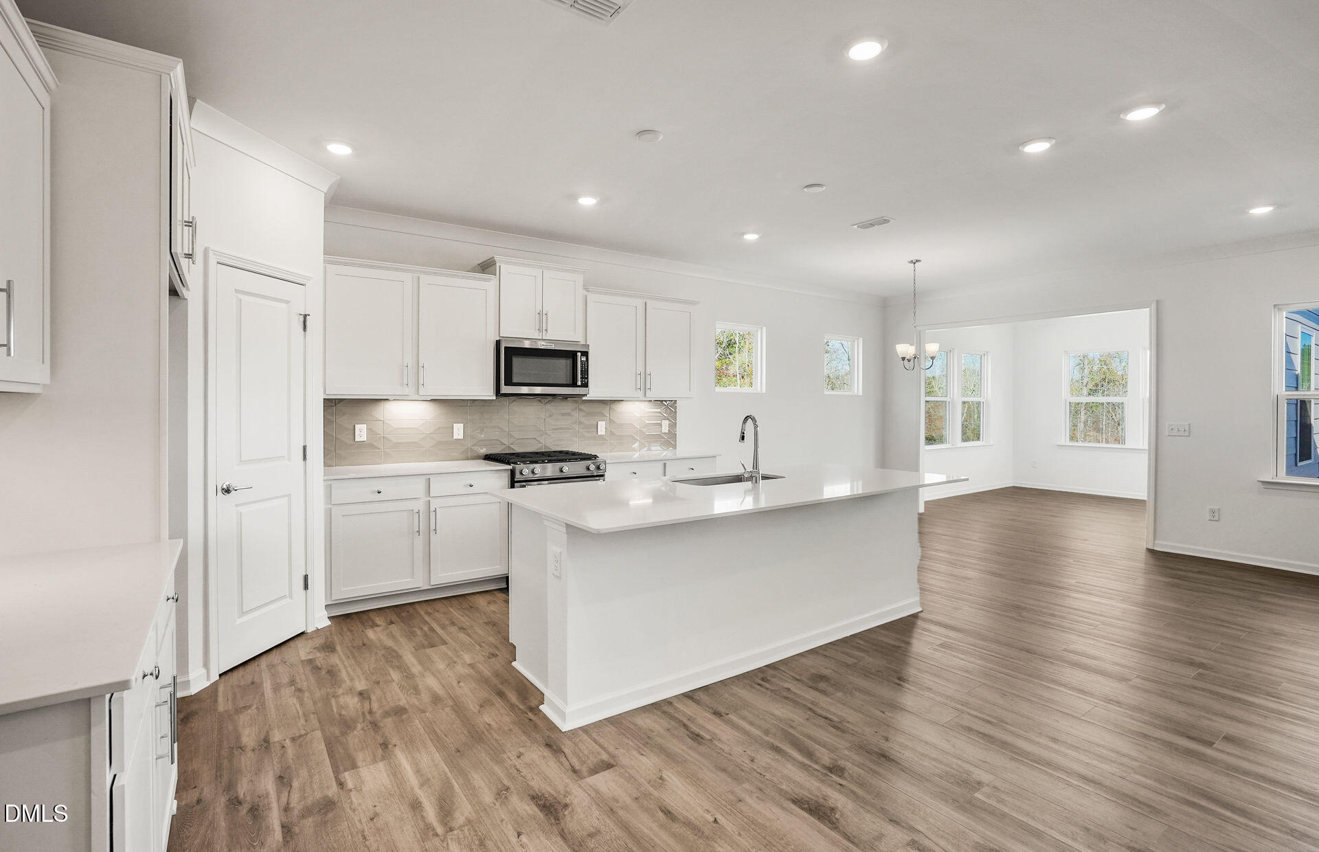 200 Armorial Court Willow Spring, NC 27592 - Photo 5 of 33 a kitchen with stainless steel appliances a refrigerator and a stove top oven