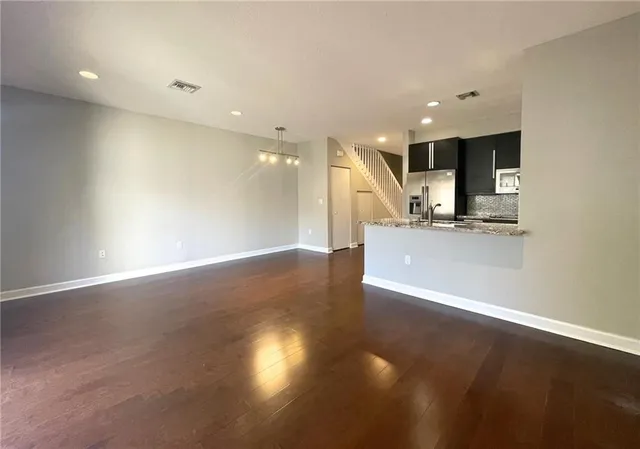 a view of a kitchen with a sink and a microwave