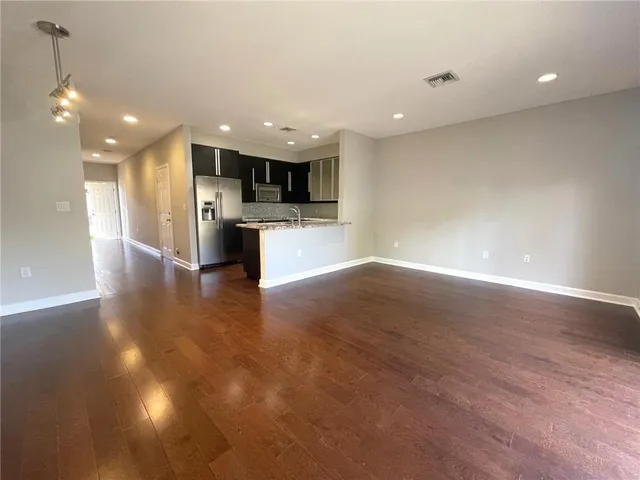 a view of kitchen with sink and microwave