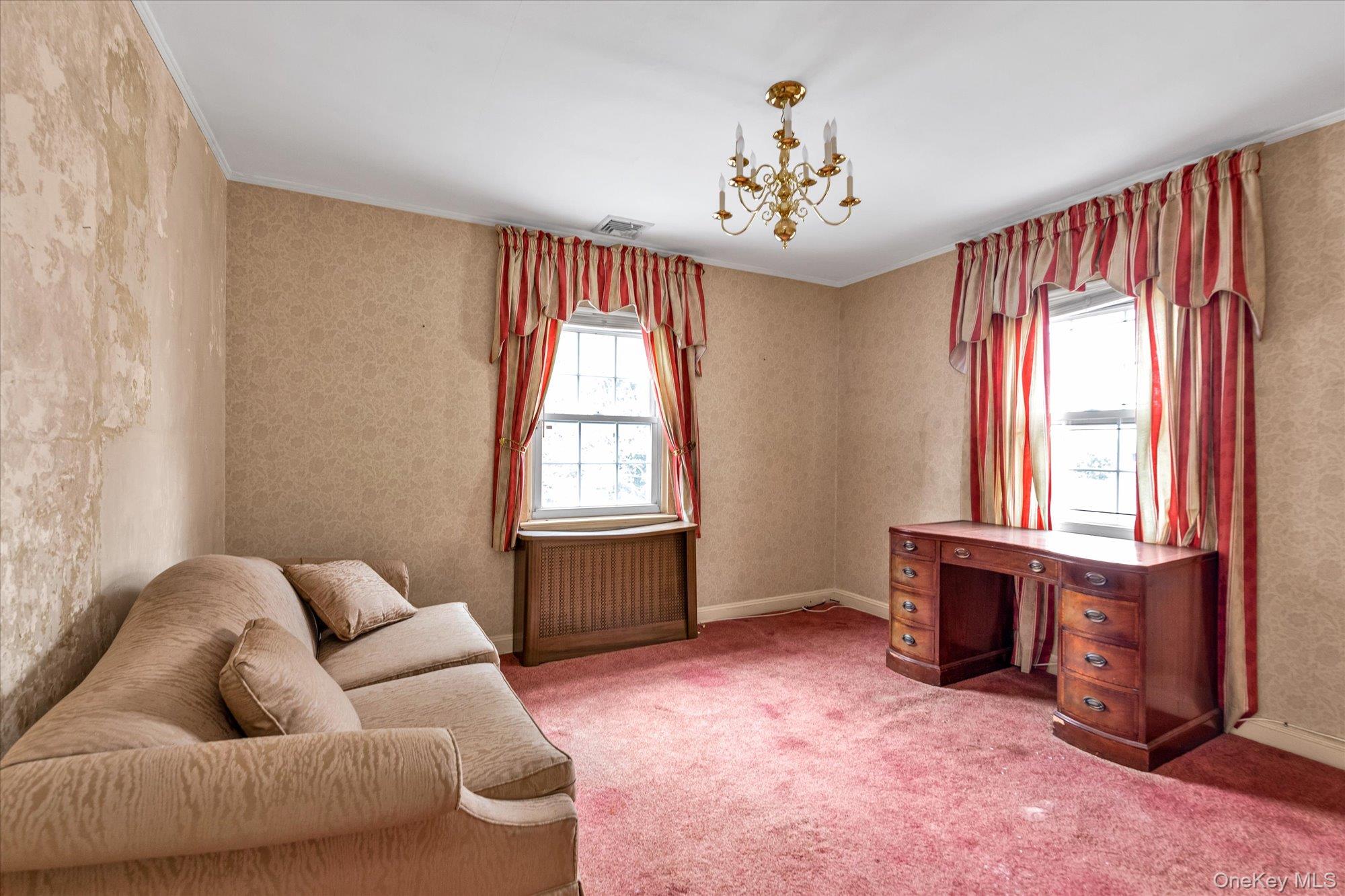 47-44 Glenwood Street Queens, NY 11362 - Photo 14 of 23 a living room with furniture and a chandelier