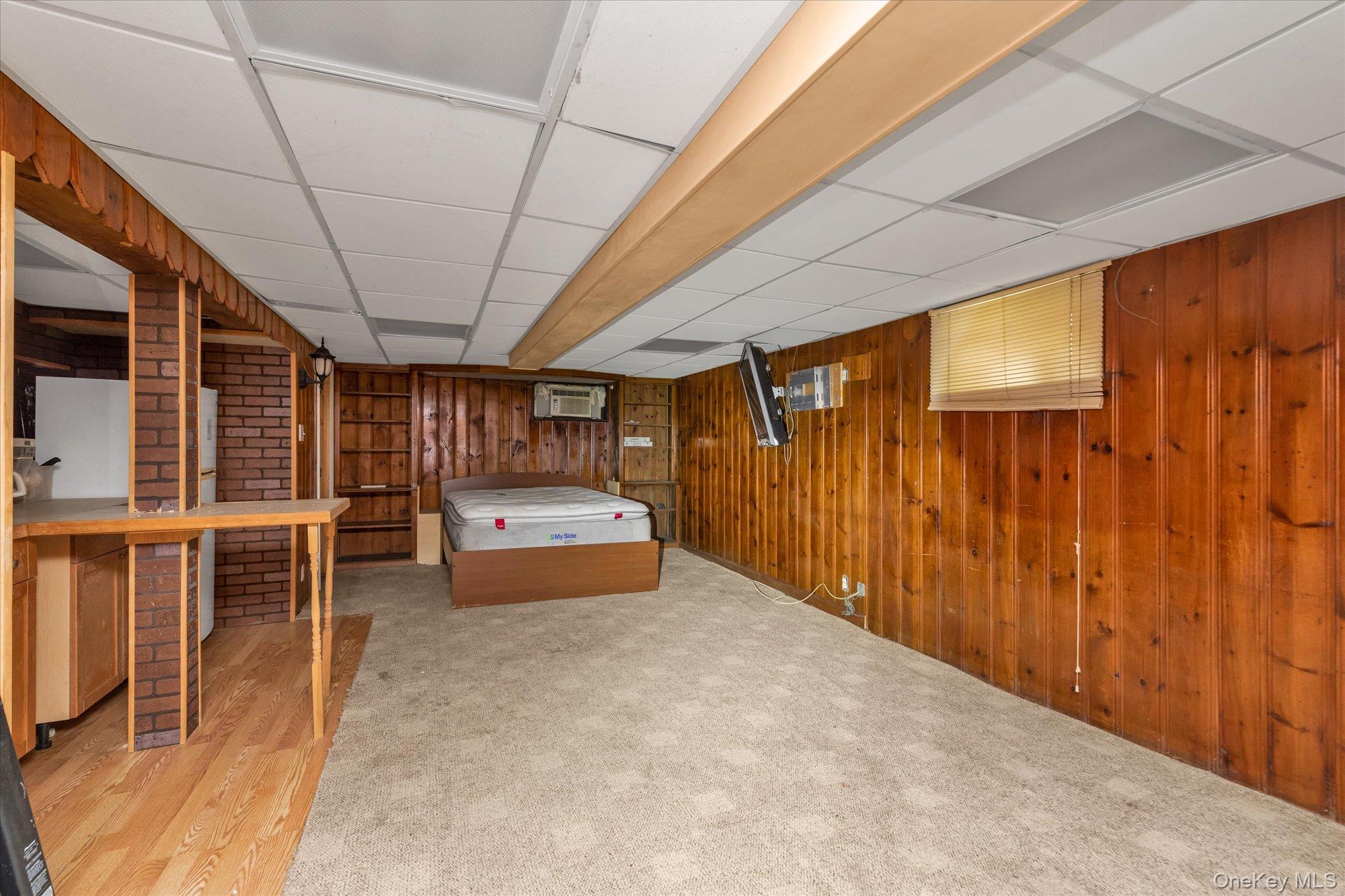 47-44 Glenwood Street Queens, NY 11362 - Photo 19 of 23 a view of a room with wooden walls