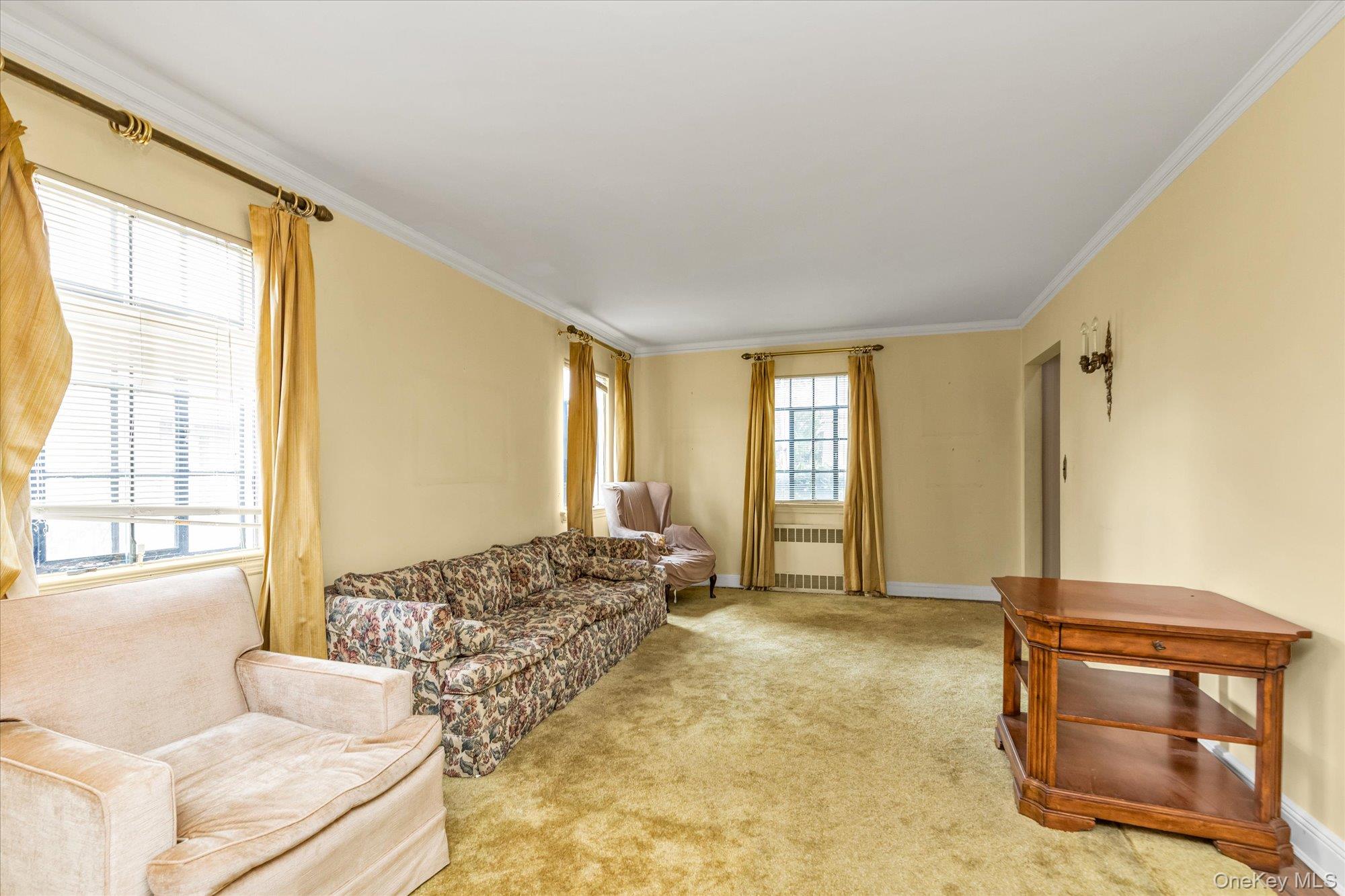47-44 Glenwood Street Queens, NY 11362 - Photo 4 of 23 a spacious bedroom with a bed and wooden floor