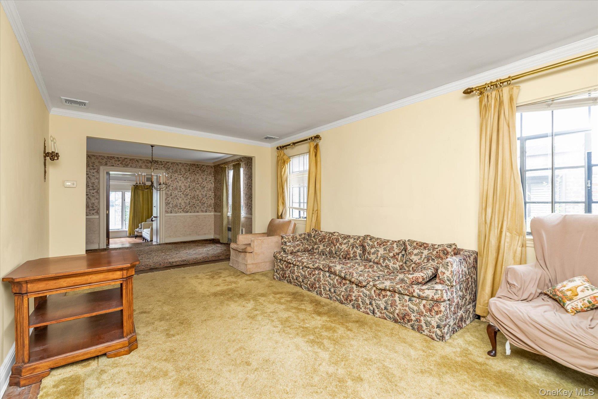 47-44 Glenwood Street Queens, NY 11362 - Photo 5 of 23 a living room with furniture and a window