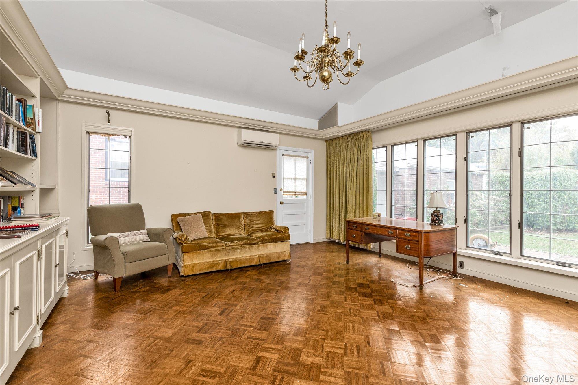47-44 Glenwood Street Queens, NY 11362 - Photo 10 of 23 a living room with furniture and a large window