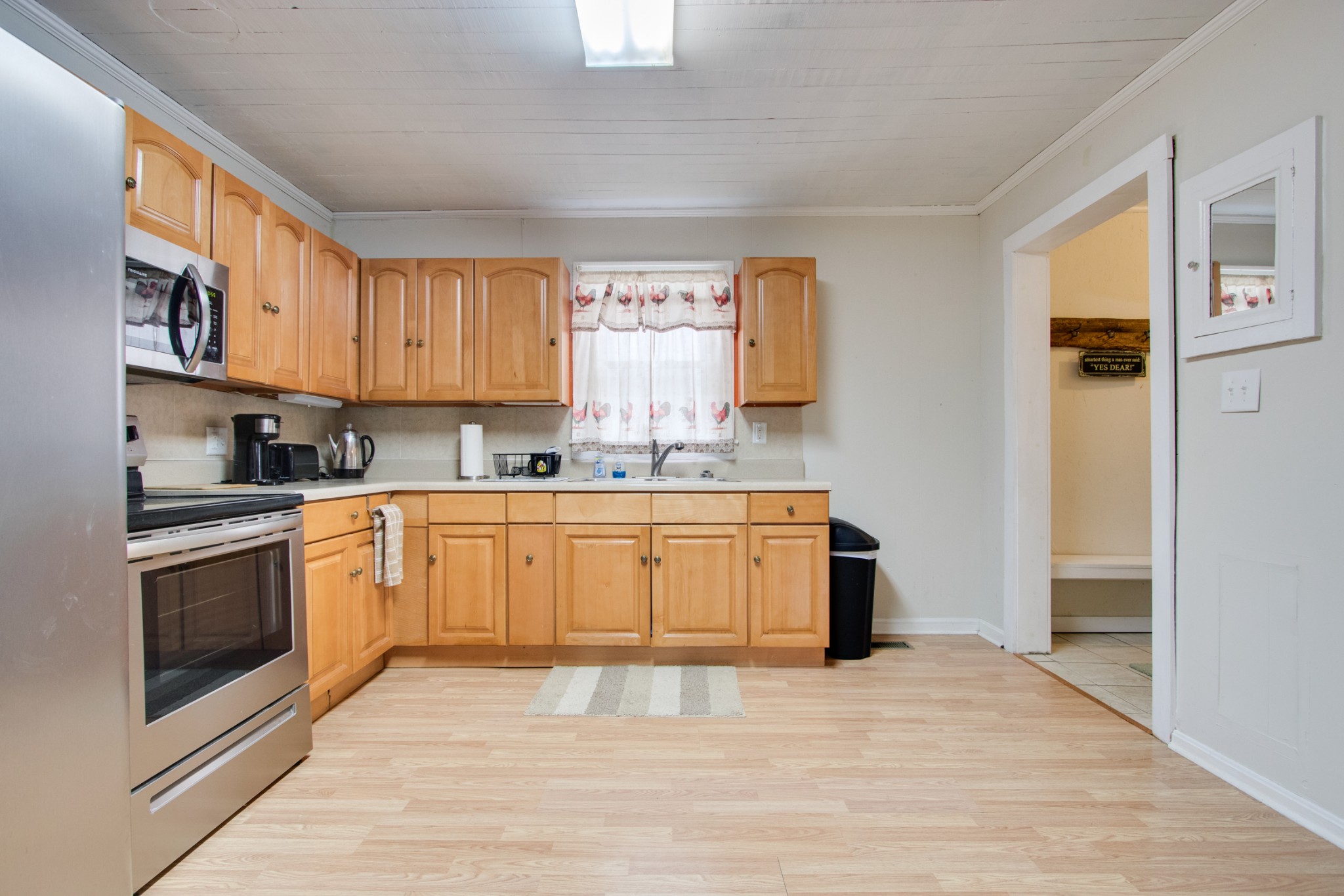 340 South Commerce Road Watertown, TN 37184 - Photo 14 of 38 a kitchen with stainless steel appliances granite countertop a stove a sink and a refrigerator
