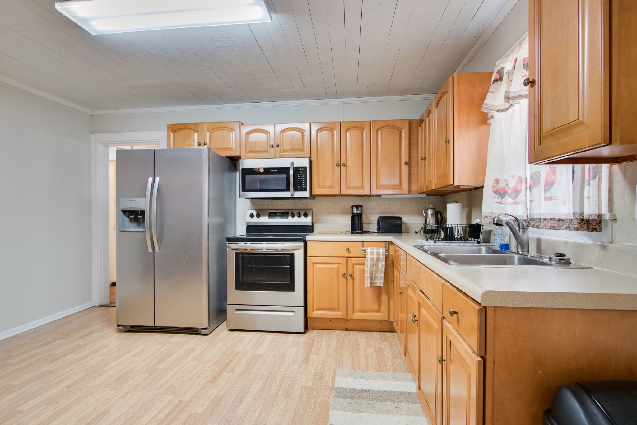 340 South Commerce Road Watertown, TN 37184 - Photo 15 of 38 a kitchen with stainless steel appliances a refrigerator sink and cabinets