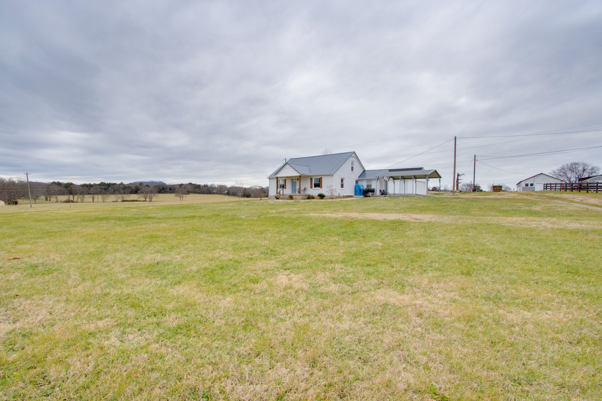 340 South Commerce Road Watertown, TN 37184 - Photo 3 of 38 a view of a lake with houses in the back