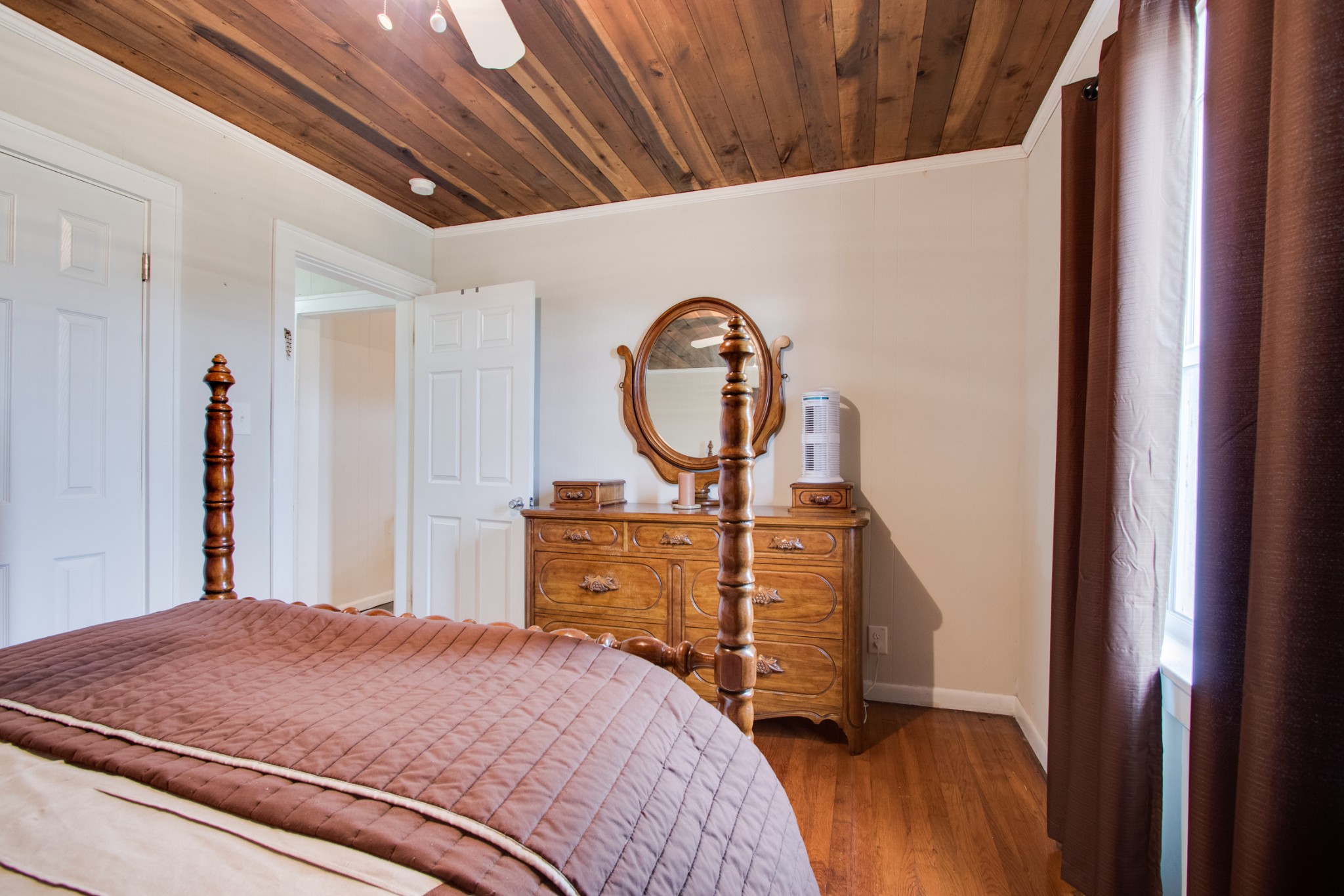 340 South Commerce Road Watertown, TN 37184 - Photo 22 of 38 a bed sitting in a bedroom next to a window