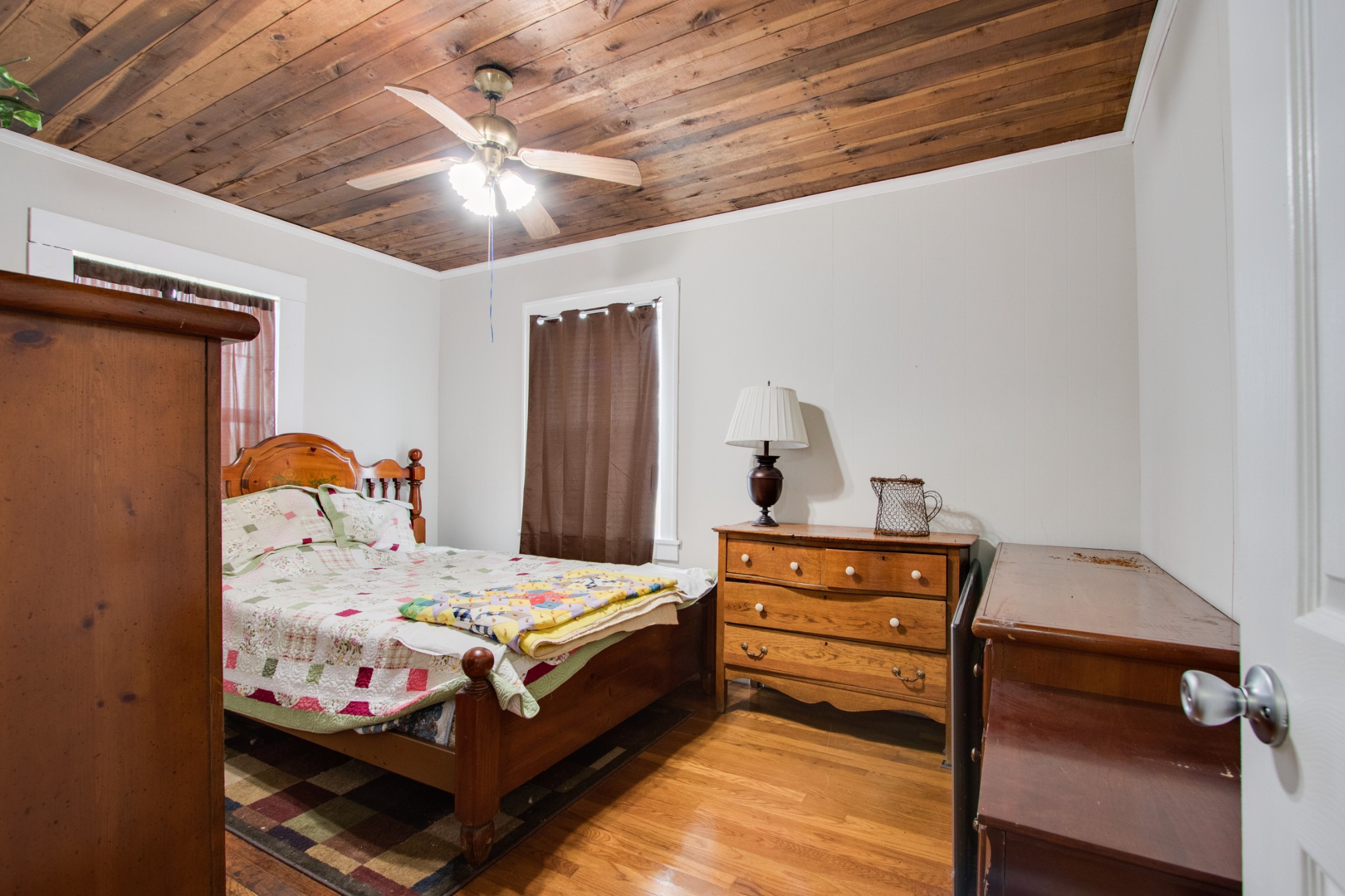 340 South Commerce Road Watertown, TN 37184 - Photo 25 of 38 a bedroom with a bed and wooden floor