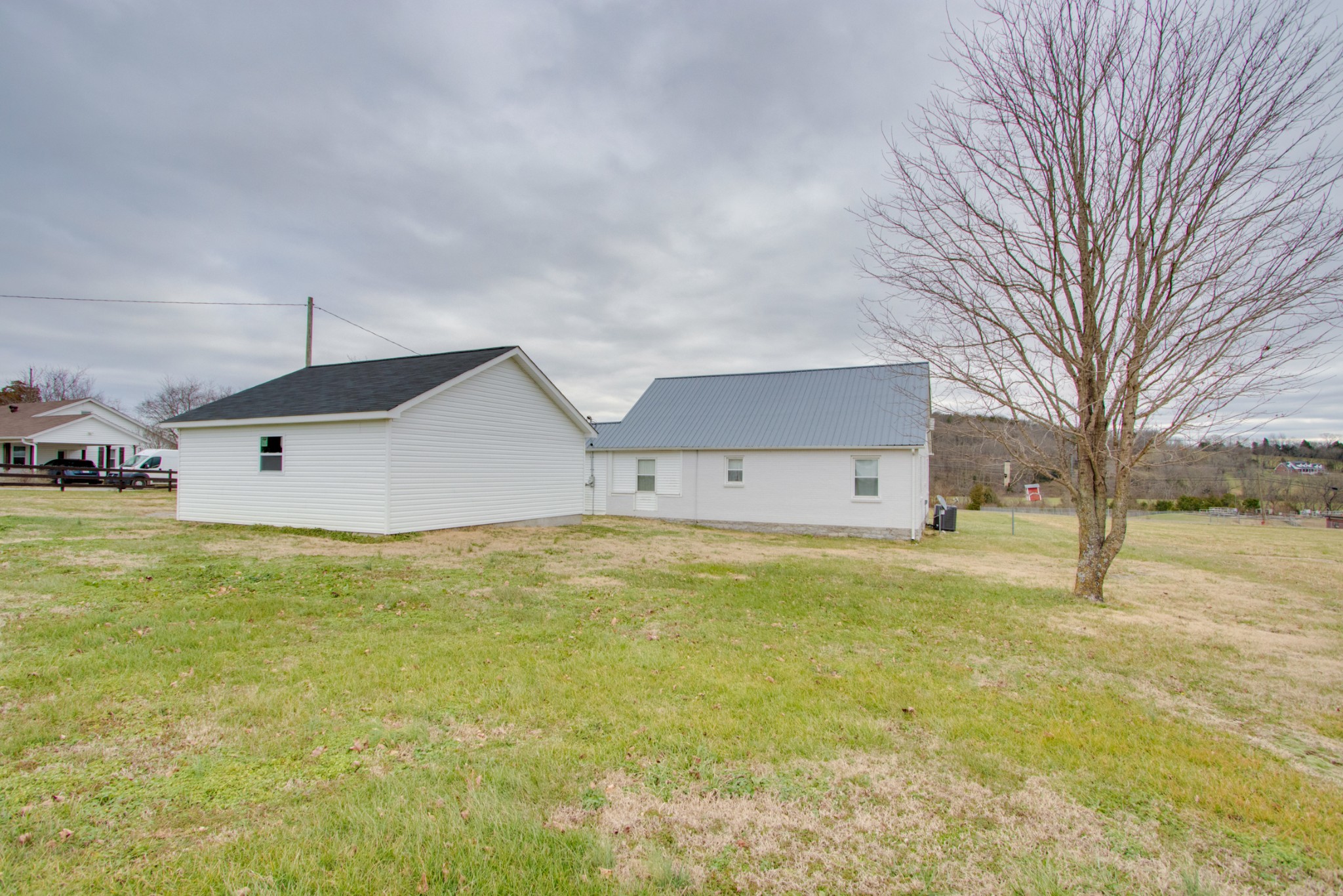 340 South Commerce Road Watertown, TN 37184 - Photo 35 of 38 a house view with a swimming pool in front of it