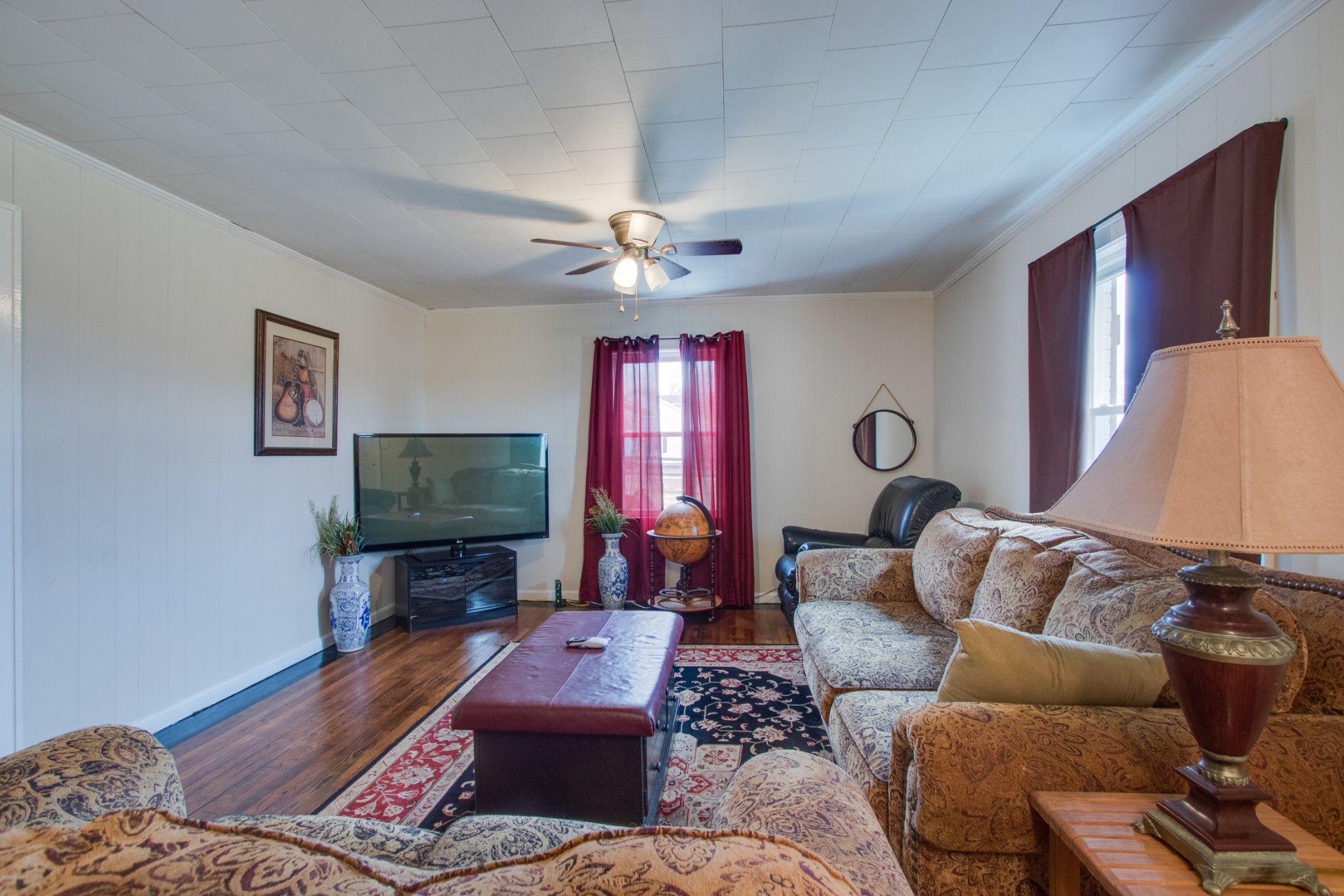 340 South Commerce Road Watertown, TN 37184 - Photo 8 of 38 a living room with furniture a flat screen tv and a window