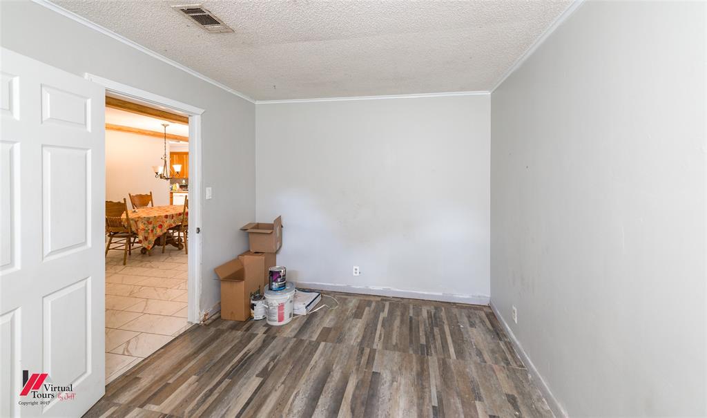 423 11th Street Northeast Springhill, LA 71075 - Photo 14 of 24 Room with wood-finish flooring and light gray walls