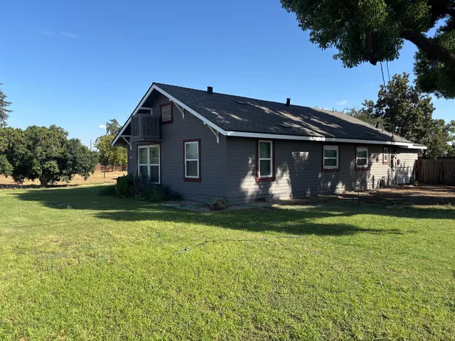 a view of a backyard of a house