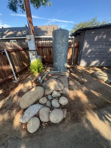 a view of house with outdoor space and swimming pool