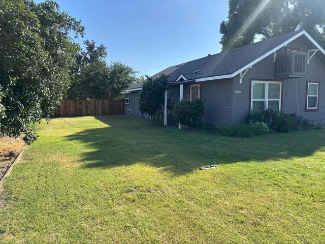 a view of a yard in front of a house