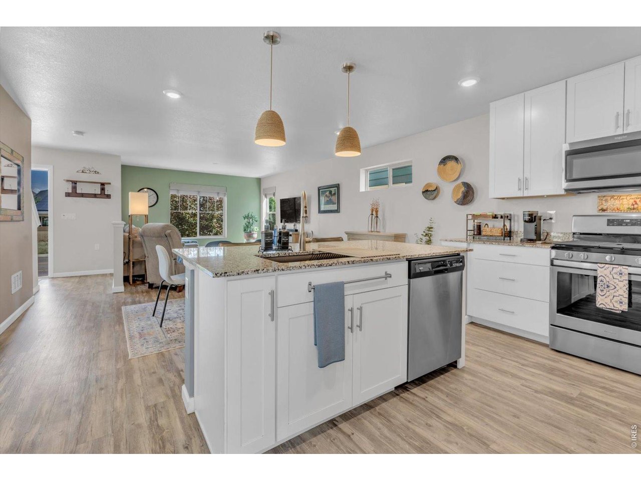 69 Quail Road Longmont, CO 80501 - Photo 4 of 25 Kitchen opens to dining room, which adjoins living room!
