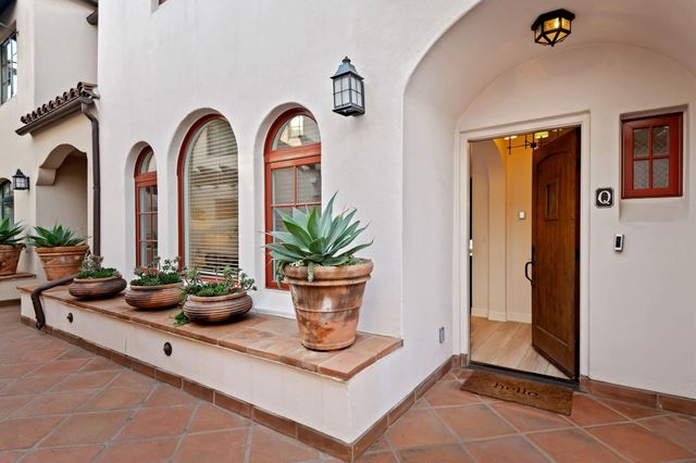 a view of lobby with furniture and a potted plant