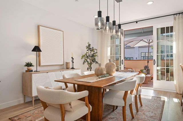 a view of a dining room with furniture and window